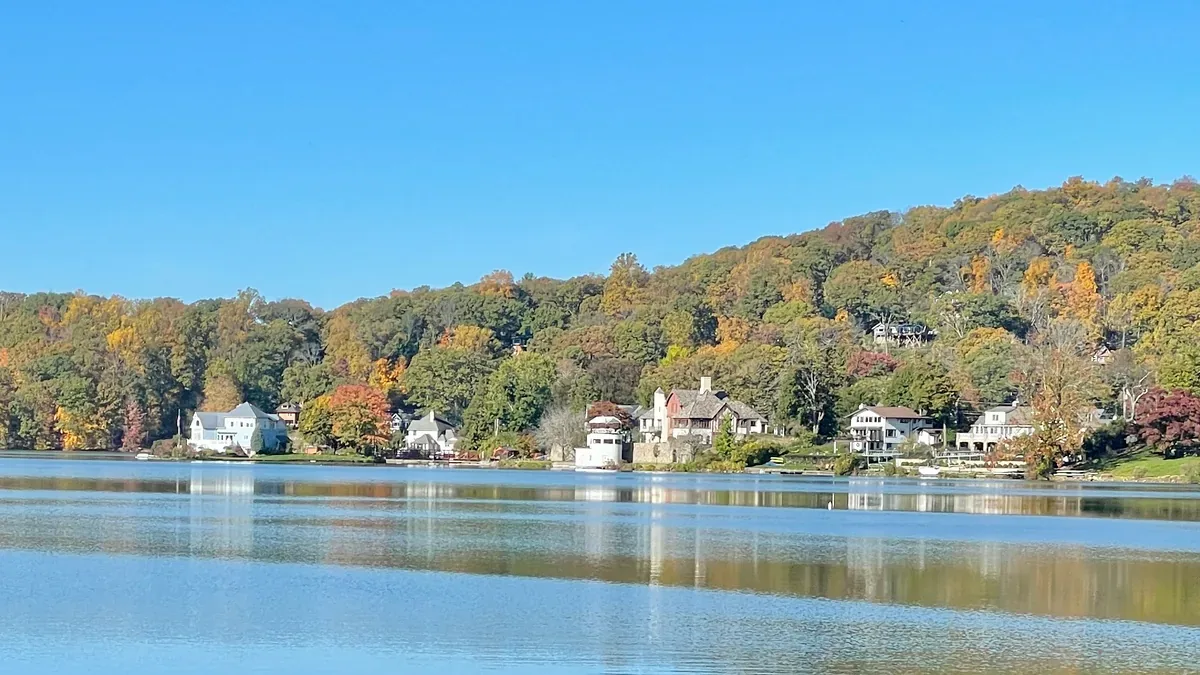 Lake Mohawk shoreline with lakeside homes and autumn trees in Sparta, New Jersey